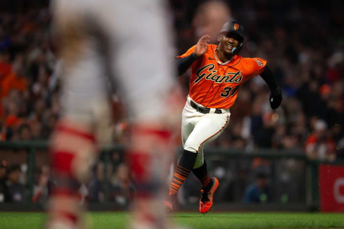 SF Giants shortstop Marco Luciano digs for home plate on an RBI single by Michael Conforto during the sixth inning against the Boston Red Sox at Oracle Park on July 28, 2023.